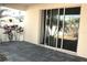 Spacious back patio with sliding glass doors at 1569 Thetford Cir, Orlando, FL 32824