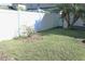 Private backyard with grassy area and fence at 1569 Thetford Cir, Orlando, FL 32824
