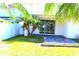Backyard with patio and tropical plants at 1569 Thetford Cir, Orlando, FL 32824