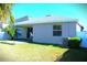 House exterior and backyard with patio at 1569 Thetford Cir, Orlando, FL 32824