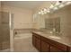 Elegant bathroom with double sinks and a shower at 1569 Thetford Cir, Orlando, FL 32824