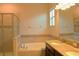 Double vanity bathroom with soaking tub and shower at 1569 Thetford Cir, Orlando, FL 32824