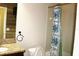 Small bathroom with shower and granite countertop at 1569 Thetford Cir, Orlando, FL 32824