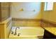 Relaxing bathroom with soaking tub, shower, and granite vanity at 1569 Thetford Cir, Orlando, FL 32824
