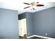 Gray bedroom with a closet and wood flooring at 1569 Thetford Cir, Orlando, FL 32824