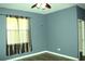 Bedroom with gray walls and wood flooring at 1569 Thetford Cir, Orlando, FL 32824