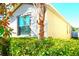 Exterior view of home showcasing landscaping at 1569 Thetford Cir, Orlando, FL 32824