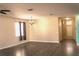 Spacious living area with gray flooring and neutral walls at 1569 Thetford Cir, Orlando, FL 32824