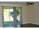 Bright living room with sliding glass doors leading to backyard at 1569 Thetford Cir, Orlando, FL 32824