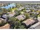 Aerial view of houses and lake in a peaceful community at 169 Tall Pines Pass, Kissimmee, FL 34759