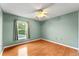 Simple bedroom with wood flooring and ceiling fan at 2943 Elbib Dr, Saint Cloud, FL 34772