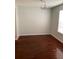 Dining room with dark wood laminate flooring and a chandelier at 4119 Dijon Dr # 4119H, Orlando, FL 32808