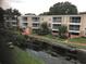 Exterior view of condo building and canal at 4119 Dijon Dr # 4119H, Orlando, FL 32808