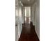 Hallway with light walls and dark wood laminate flooring at 4119 Dijon Dr # 4119H, Orlando, FL 32808