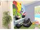 Playful game room with superhero mural, gaming chairs and TVs at 5364 Diplomat Ct # 106, Kissimmee, FL 34746