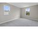 Well-lit bedroom with carpet flooring and two windows at 670 Summit River Dr, Apopka, FL 32712