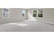 Bright bedroom with carpet flooring and multiple windows at 670 Summit River Dr, Apopka, FL 32712