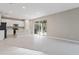 Open concept kitchen and living area with tile flooring and sliding glass doors at 670 Summit River Dr, Apopka, FL 32712