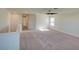 Spacious bedroom with two windows and a ceiling fan at 674 Anna Ridge Rd, Minneola, FL 34715