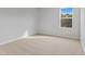 Bright bedroom featuring carpeted floors and a large window at 680 Summit River Dr, Apopka, FL 32712