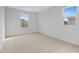 Well-lit bedroom with carpeted floors and two windows at 680 Summit River Dr, Apopka, FL 32712