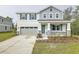 Two-story house with gray siding, teal shutters, and stone accents at 680 Summit River Dr, Apopka, FL 32712