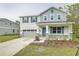 Two-story house with gray siding, teal shutters, and stone accents at 680 Summit River Dr, Apopka, FL 32712