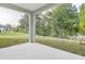 Covered patio overlooking a grassy backyard at 680 Summit River Dr, Apopka, FL 32712