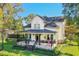 Beautiful two-story home with a wraparound porch and manicured lawn at 729 Main Street, Windermere, FL 34786
