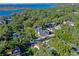 Aerial view of a house, pool, and a beautiful lake view at 729 Main Street, Windermere, FL 34786