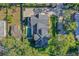 Aerial view of a house with a pool and lush landscaping at 729 Main Street, Windermere, FL 34786