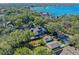 Aerial view of a two-story house near the lake, featuring a large backyard and detached garage at 729 Main Street, Windermere, FL 34786