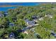 Aerial view of a house, pool, and a beautiful lake view at 729 Main Street, Windermere, FL 34786