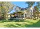 Charming two-story home with a large front porch and lush lawn at 729 Main Street, Windermere, FL 34786