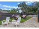 Relaxing backyard patio with seating area and artificial turf at 729 Main Street, Windermere, FL 34786