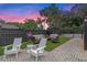 Relaxing backyard patio with seating area and artificial turf at 729 Main Street, Windermere, FL 34786
