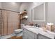 Clean bathroom with marble vanity, shower and neutral color scheme at 729 Main Street, Windermere, FL 34786
