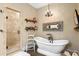 Spa-like bathroom featuring a freestanding bathtub, walk-in shower, and decorative accents at 729 Main Street, Windermere, FL 34786