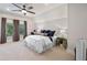 Spacious bedroom with plush bed, large window and carpeted floor at 729 Main Street, Windermere, FL 34786