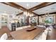 Spacious dining area showcasing a large wooden table, hardwood floors, and open floor plan at 729 Main Street, Windermere, FL 34786