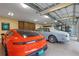 Large garage with epoxy flooring and ample space for multiple cars at 729 Main Street, Windermere, FL 34786