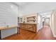 Long hallway with wood floors and built-in shelving at 729 Main Street, Windermere, FL 34786