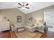 Cozy sitting area with comfortable sectional sofa and hardwood floors at 729 Main Street, Windermere, FL 34786
