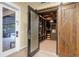 Impressive wine cellar with rustic wood doors and climate control at 729 Main Street, Windermere, FL 34786