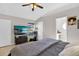 Bright bedroom with a large bed, TV, and plenty of natural light at 905 Gascony Ct, Kissimmee, FL 34759