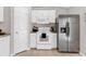 Kitchen with stainless steel appliances and white cabinets at 905 Gascony Ct, Kissimmee, FL 34759