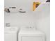 Laundry room with washer, dryer, and overhead shelving at 905 Gascony Ct, Kissimmee, FL 34759