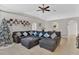 Open and airy living room with a large sectional sofa and a high ceiling at 905 Gascony Ct, Kissimmee, FL 34759
