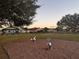 Community playground with swings and spring riders at 905 Gascony Ct, Kissimmee, FL 34759