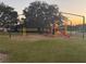 Community playground with playset and shade structure at 905 Gascony Ct, Kissimmee, FL 34759